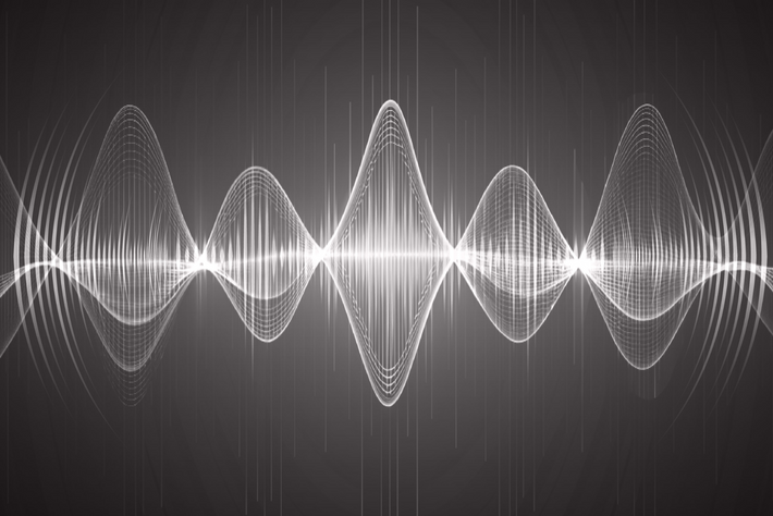 White sound wave pattern on a black background
