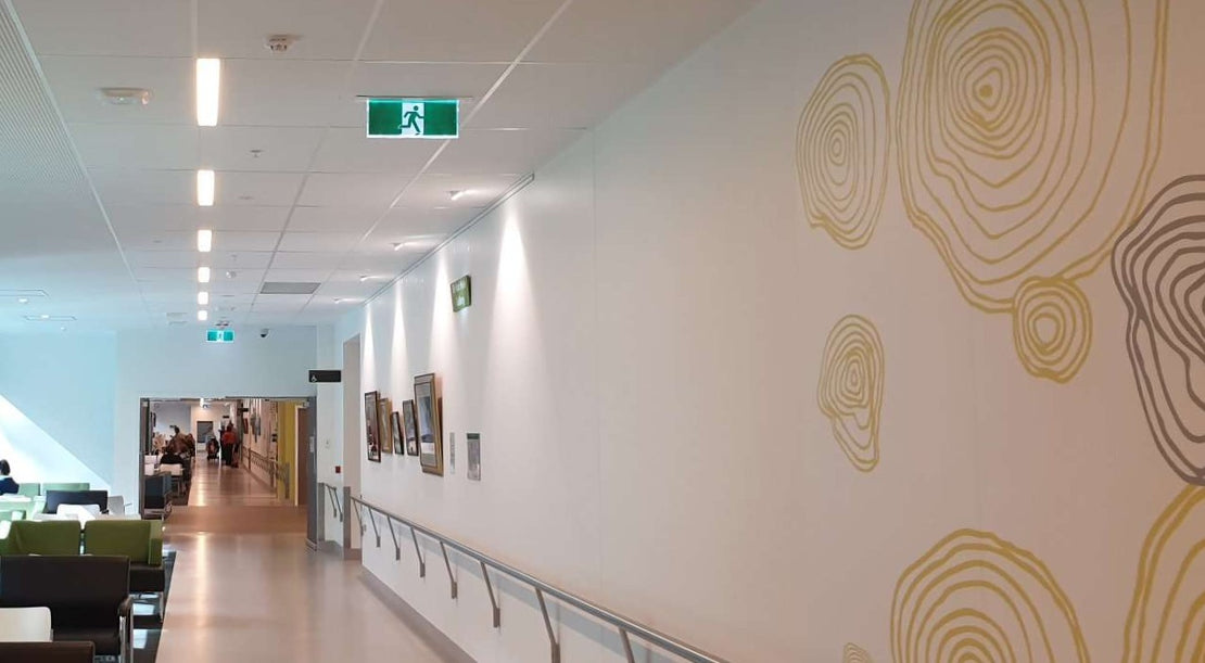 Corridor with patterned wall and exit sign