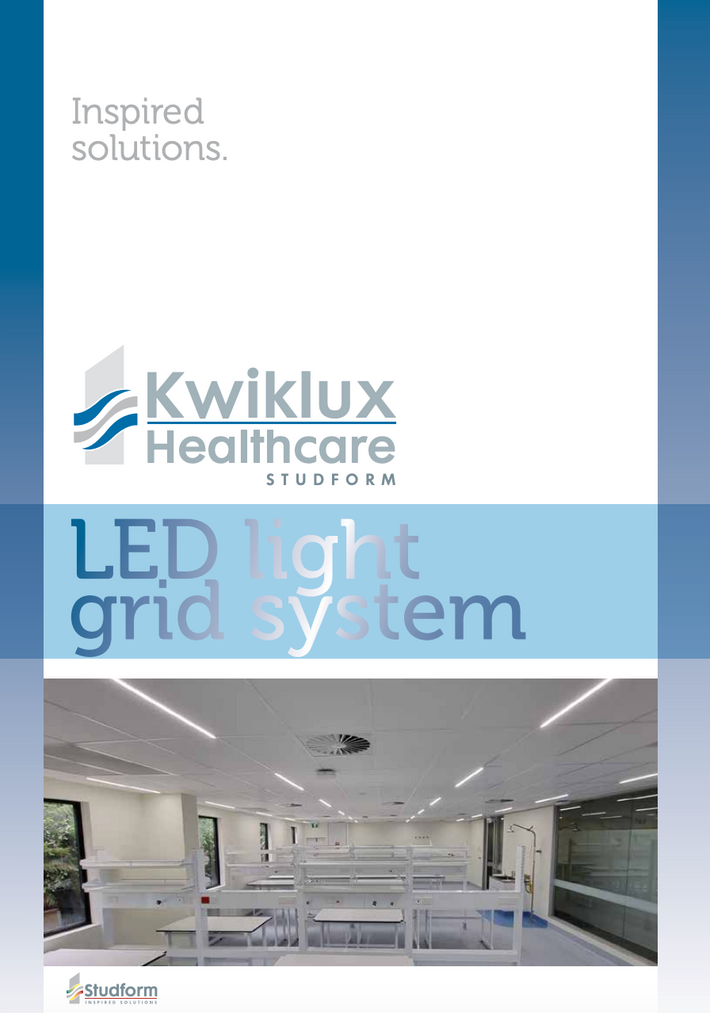 A promotional graphic for the Kwiklux Healthcare LED light grid system, featuring the Kwiklux Healthcare logo, the text 'LED light grid system,' and a photo of a modern, brightly lit office interior with rows of white desks and ceiling-mounted LED lights.