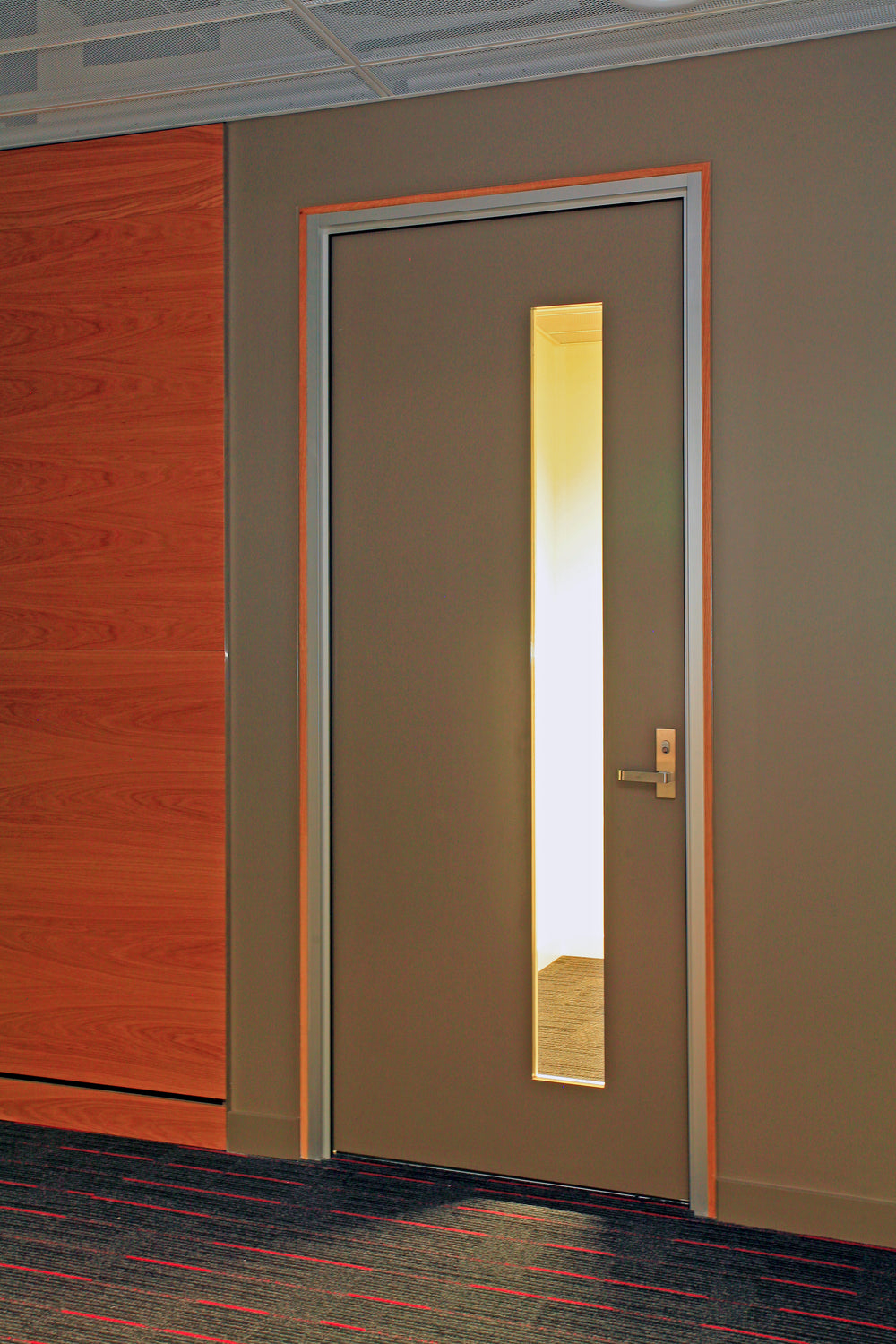 Door with a glass panel in an indoor setting