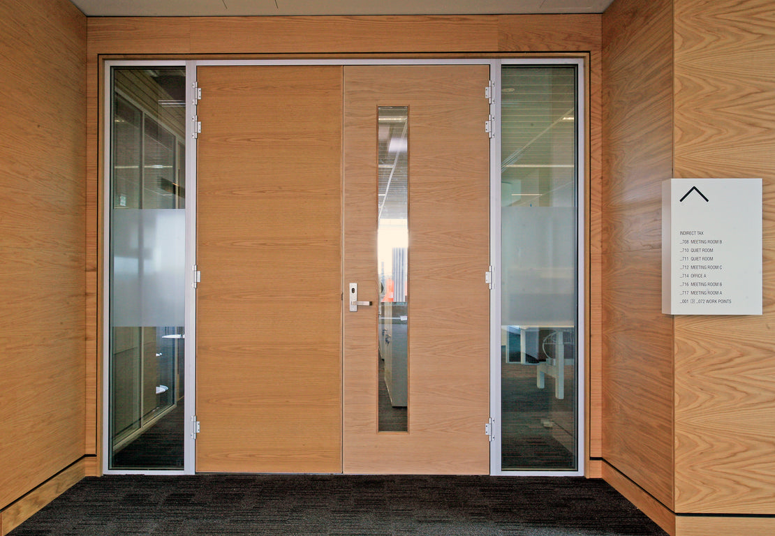 Wooden doors with glass panels in a Adelaide's Tower 8 building. 