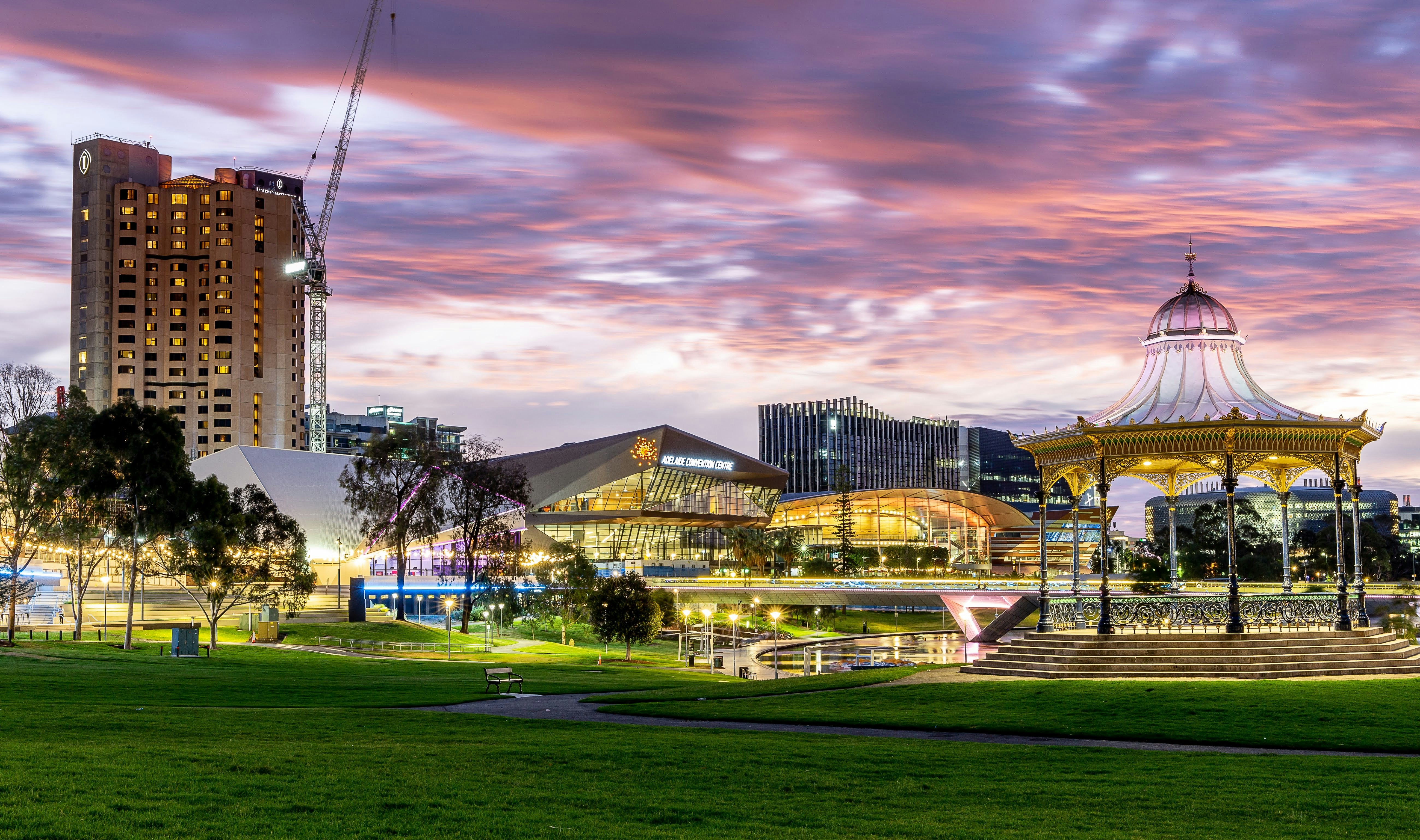 Adelaide cityscape - the River Torrens and Adelaide Convention Centre lit up in bright lights. 